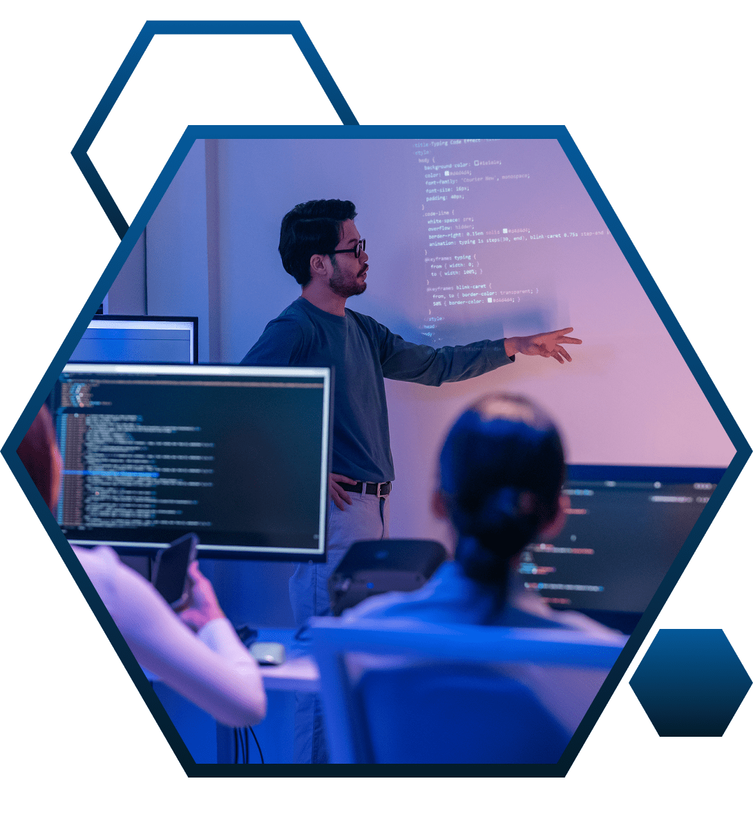 Man presenting code to an audience.